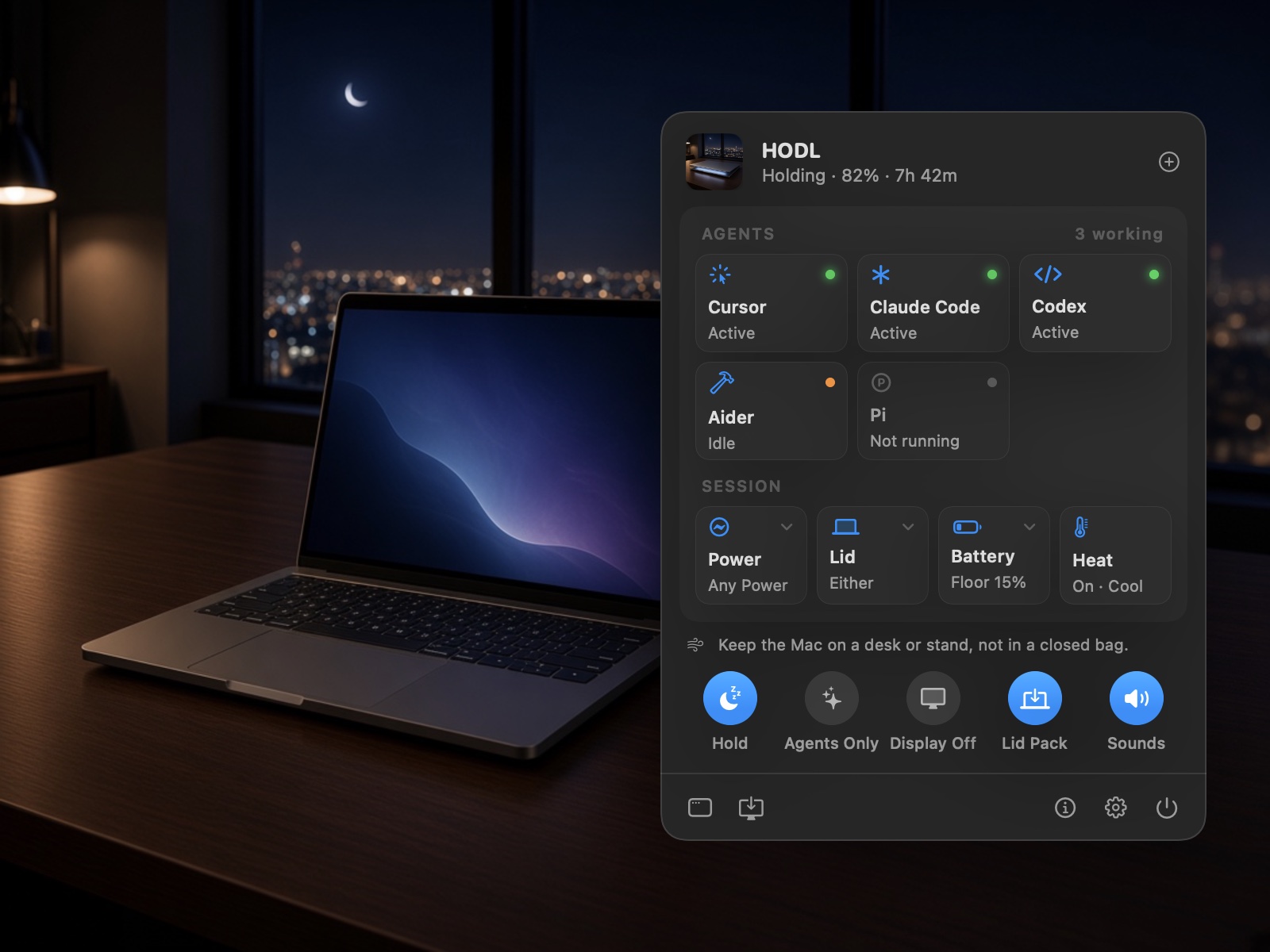 An open MacBook on a dark desk at night in front of city lights, beside the HODL panel reading “Holding · 82% · 7h 42m”, with Cursor, Claude Code, and Codex marked Active, Aider Idle, and tiles for Power, Lid, Battery, and Heat.